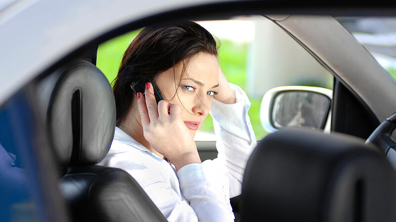 woman speaks by phone