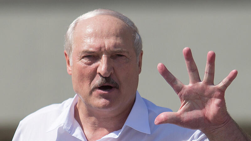 Belarusian President Lukashenko delivers a speech during a rally of his supporters in Minsk