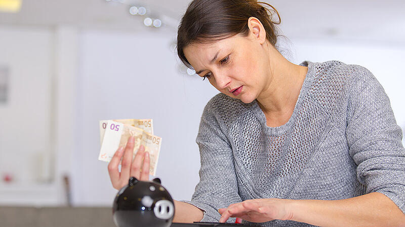 portrait of woman counting money