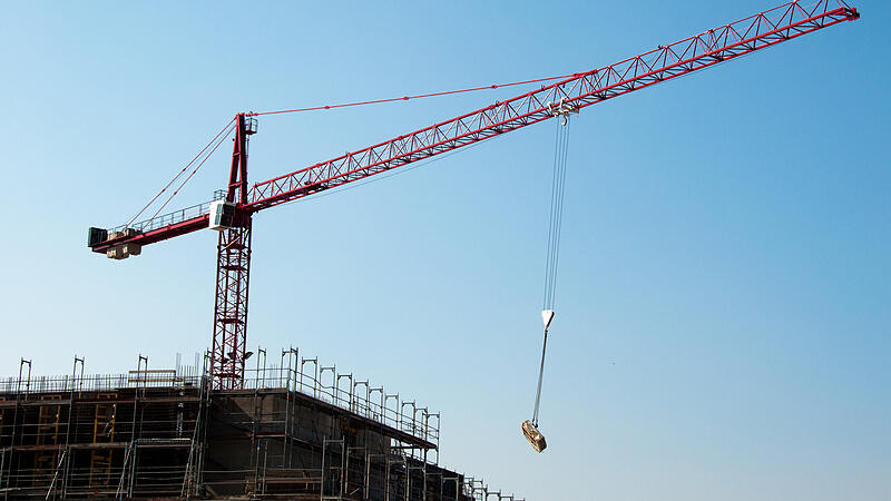 Construction site with crane and building