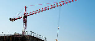 Construction site with crane and building