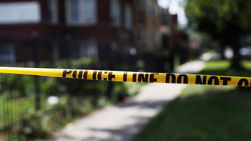 Chicago police crime scene tape is posted at the scene of a gun shooting on the South Side of Chicago