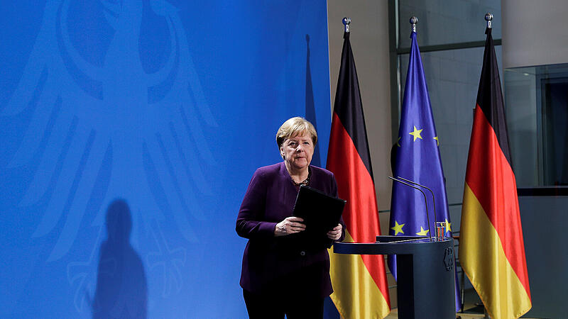 German Chancellor Angela Merkel leaves after holding a news conference about the coronavirus outbreak disease (COVID-19) in Berlin