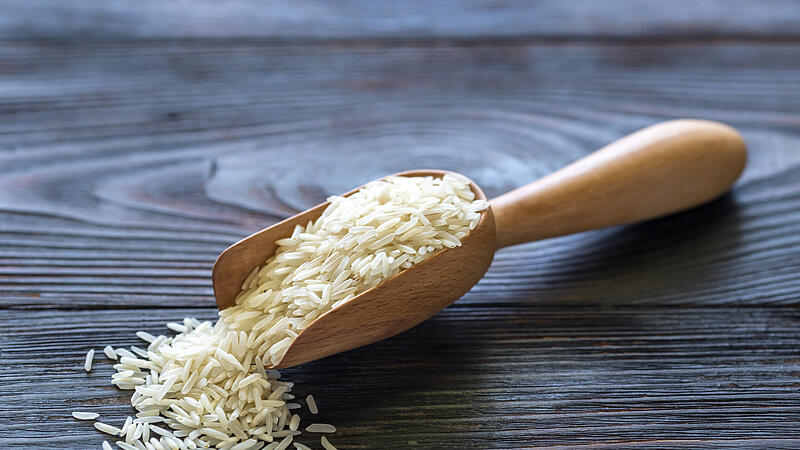 Scoop of uncooked basmati rice