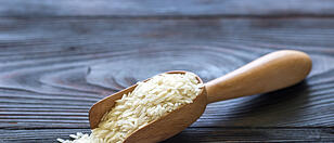 Scoop of uncooked basmati rice