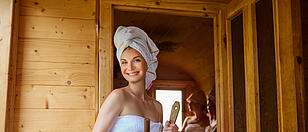 three girls relaxing in sauna