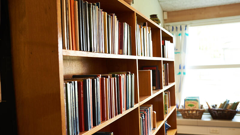 a bookshelf at a school library