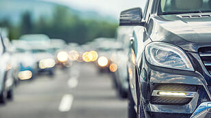 Traffic jam on the highway. Cars waiting on the road in the dense tourist season.