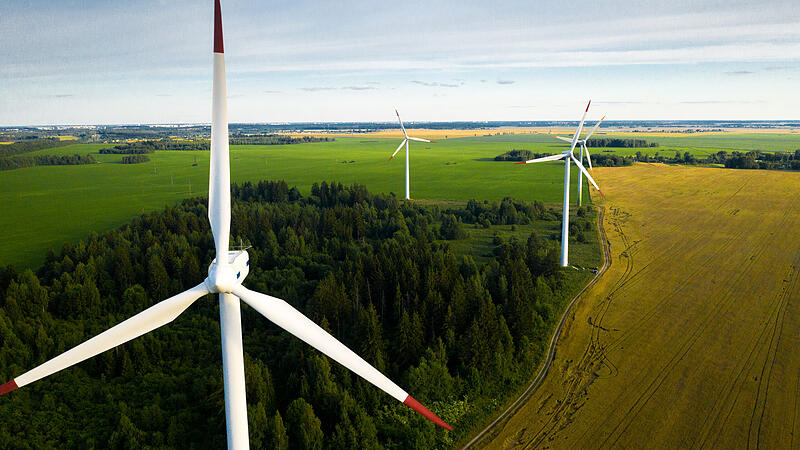 Windmills on the background of forests and fields. Windmill in nature.Belarus