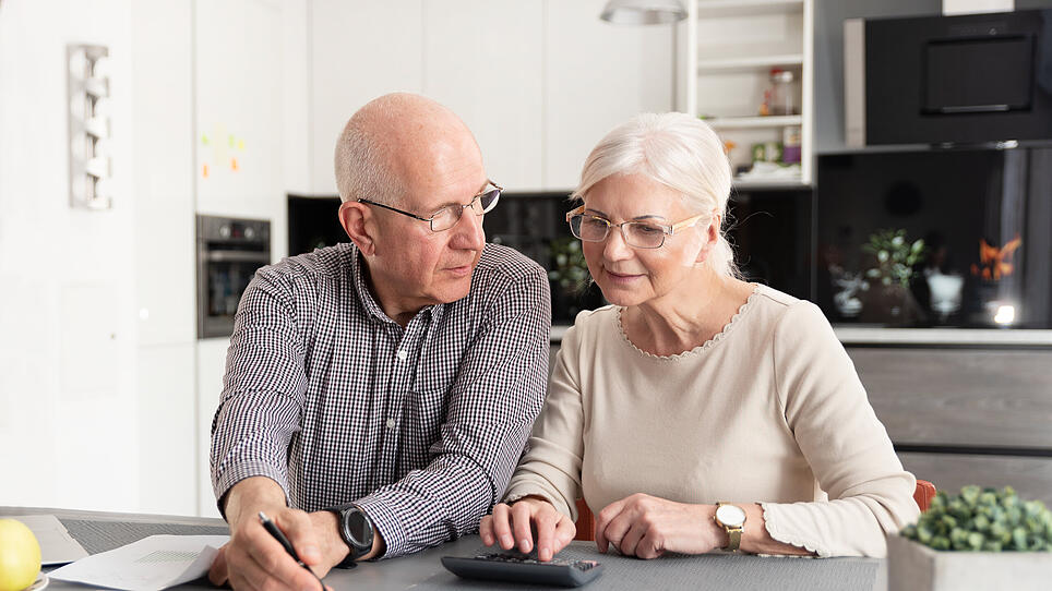 Senior couple discussing investment
