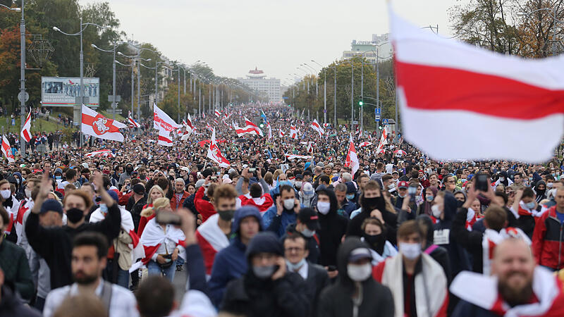 Belarusian opposition supporters hold a rally in Minsk